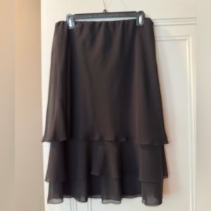 Evening attire. Sheer A-line black, short, tiered skirt. Size Large.
